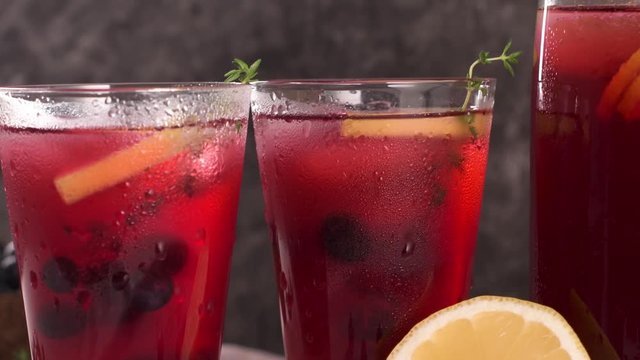 Fresh blueberry summer mojito cocktail. Blueberry lemonade or sangria on kitchen countertop.