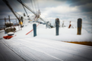 desk of free space and winter ship background. 