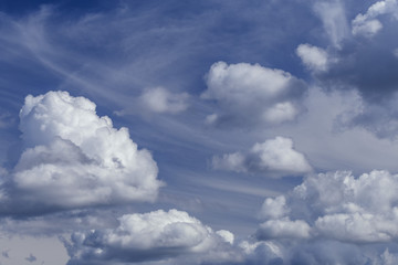 Fototapeta na wymiar large cumulus clouds in the blue sky as a natural background