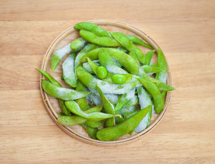 studio shot of Japanese style boiled beans EDAMAME on basket..