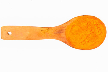 orange powder on wooden spoon with clipping path in isolated on white background