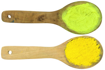 yellow and light yellow powder on wooden spoons with clipping path in isolated on white background