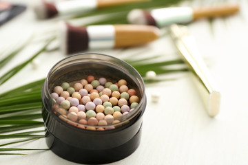 Highlighter on table. Decorative cosmetics