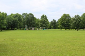 Fototapeta na wymiar A view of the playground area on the green grass land.