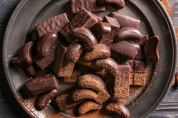 Delicious chocolate candies on metal tray
