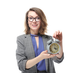 Mature woman with alarm clock on white background. Time management concept