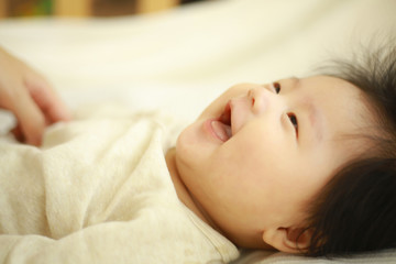 Obraz na płótnie Canvas 笑顔の赤ちゃん