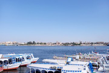 Obraz premium View of river with berthed ships in dock