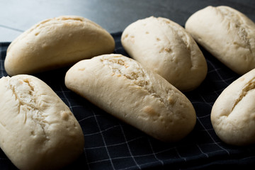 Raw Baguette Bread Ready to Bake in the Oven.