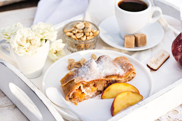 strudel with peaches, apples and peanuts