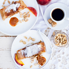 strudel with peaches, apples and peanuts