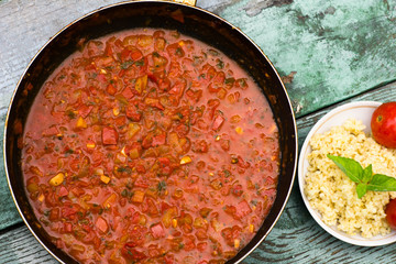 large pan of Italian sauce with tomatoes