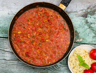 large pan of Italian sauce with tomatoes