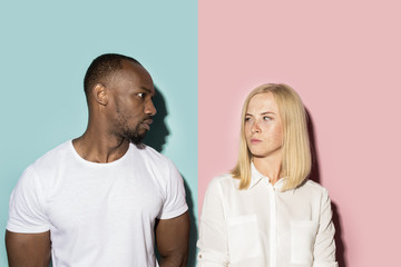 Man and woman posing at studio during quarrel