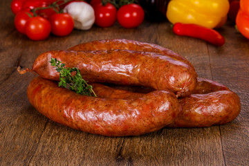 Pork sausages over wooden