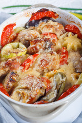 Traditional tasty rustic stew of chicken and vegetables, decorated with tomatoes