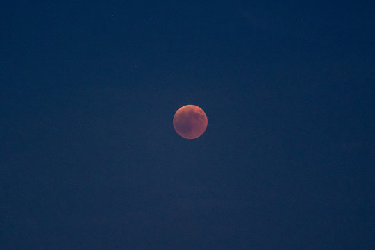 Red moon on dark sky