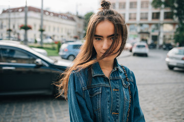 Fototapeta premium Portrait of happy young woman with long dark hair