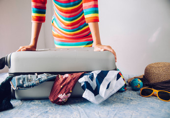 Tourists are packing luggage for travel.