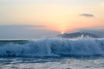 Waves on sunrise in Nha Trang
