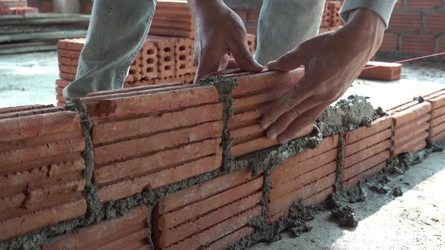 Worker building masonry house wal