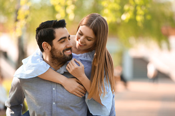 Fototapeta premium Happy young couple in park on spring day