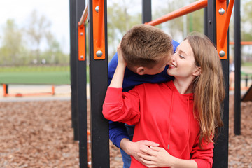 Obraz premium Happy young couple on playground