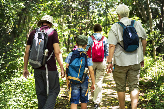 Family Hiking In A Forest