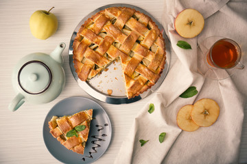 Composition with delicious apple pie on table, top view