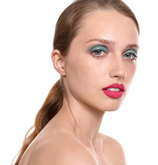 Young woman with professional makeup on white background