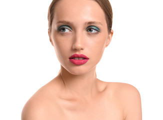 Obraz premium Young woman with professional makeup on white background