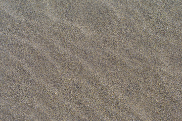 vision of a beach sand texture. Medium-sized beach sand of warm yellow color.