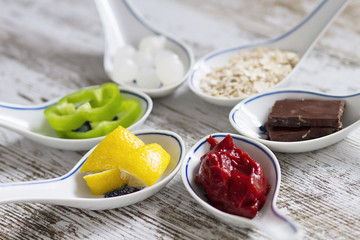 Porcelain spoons with doos ingredients