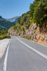 Road in Spain with blue sky and sunlight as background