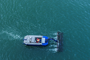 Collecting waste from the sea, Santo Domingo, Dominican Republic