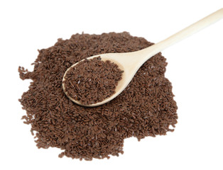 Flax seeds in a wooden spoon on white isolated background