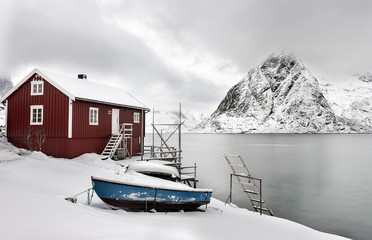 A Rorbu on the coast near Sakrisoy on the Lofoten islands, Norway, looking towards Olstind