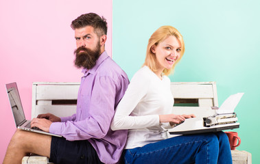 Obraz premium Try new technology. Time change old habits. Old fashioned against modern, outdated against new. Man work use modern stylish laptop and woman work retro typewriter. Can not get used new technologies