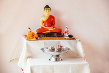 buddha statue on a privat altar