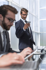 close up.business team using gadgets in a modern office