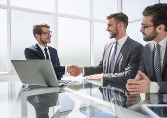 close up.business people shaking hands in the office