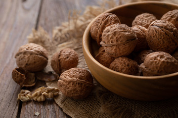 Walnuts kernels in wooden bowl, Walnut healthy food Top view