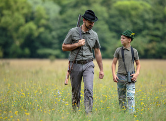 Ranger and his son in the woods