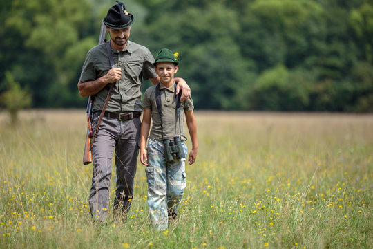 Ranger and his son in the woods