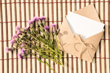 Envelope of kraft paper with a blank message and with beautiful flowers