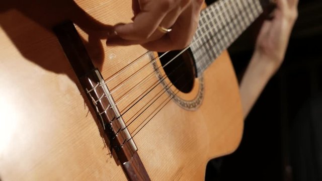 Right hand on guitar