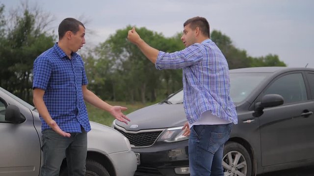 Two men arguing conflict after a car accident on the road car insurance. slow motion video. Two Drivers lifestyle man Arguing After Traffic Accident. auto insurance accident concept men. Two men