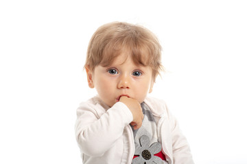 Elegant baby girl 1 year old sitting on the studio floor. White Background.