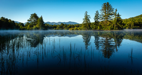 Misty morning sunrise on a pond in Franconia, N.H.