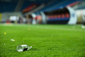 Plastic trash can on the turf on a soccer field © roibu